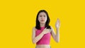 Young woman making hand sign to stop behavior or gesture that suggests unethical and illegal behavior