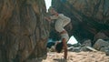 Young woman making headstand on Ursa beach. Girl practicing yoga on nature. Royalty Free Stock Photo