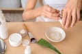 Young woman making healthy facial mask with aloe vera extract at home, closeup Royalty Free Stock Photo