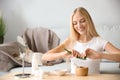 Young woman making healthy facial mask with aloe vera extract at home Royalty Free Stock Photo