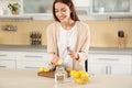 Young woman making lemon water