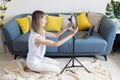 Young woman making photo or video content for social media with smartphone and light of ring lamp. Beauty blogger smiles Royalty Free Stock Photo