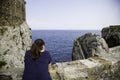 Young woman making photos to the sea Royalty Free Stock Photo