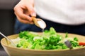 Young woman making salad Royalty Free Stock Photo