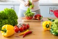 Young woman making salad in the kitchen Royalty Free Stock Photo