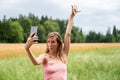 Young woman making selfies in nature Royalty Free Stock Photo