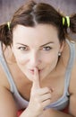 Young woman making silence gesture Royalty Free Stock Photo