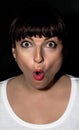 Young woman making surprised face Royalty Free Stock Photo