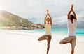 Young woman making yoga exercises on beach Royalty Free Stock Photo