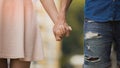 Young woman and man holding hands, tender relationship of sweet couple, love Royalty Free Stock Photo