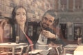 Young woman man sitting caffee shop window reflection Royalty Free Stock Photo