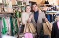 Young woman and man are standing satisfied with packadge after shopping Royalty Free Stock Photo