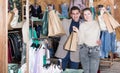 Young woman and man are standing satisfied with packadge after shopping Royalty Free Stock Photo