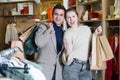 Young woman and man are standing satisfied with packadge after shopping Royalty Free Stock Photo