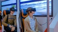 Young woman and man using virtual reality glasses and looking around: VR concept
