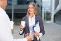 Young woman manager is talking with partner before signing contract Royalty Free Stock Photo