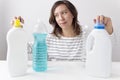 Young woman and cleaning products