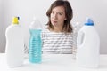 Young woman and cleaning products