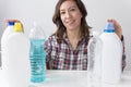 Young woman and cleaning products