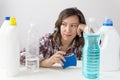 Young woman and cleaning products