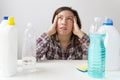 Young woman and cleaning products