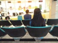 Young woman and many people waiting medical and health services to the hospital Royalty Free Stock Photo