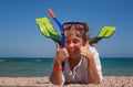 Young woman in a mask and fins for scuba diving with his eyes cl Royalty Free Stock Photo