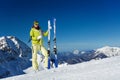 Young woman in mask stands and holds ski, poles Royalty Free Stock Photo