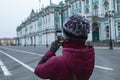 Young woman in mask walk in the city. Empty dvortsovaya square in the centre on self isolation