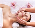 Young woman on massage table in beauty spa. Royalty Free Stock Photo