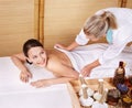 Young woman on massage table in beauty spa. Royalty Free Stock Photo