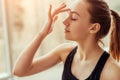 Young woman massaging third eye chakra