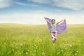 Young woman on the meadow with fabric Royalty Free Stock Photo