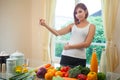 Young woman measuring her stomach Royalty Free Stock Photo