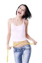 Young woman measuring her waist Royalty Free Stock Photo