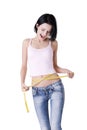 Young woman measuring her waist Royalty Free Stock Photo