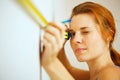 Young woman with measuring tape Royalty Free Stock Photo