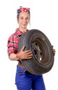 Young woman mechanic with a car wheel Royalty Free Stock Photo