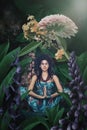 Young woman meditate in yoga position in fantasy garden Royalty Free Stock Photo