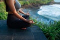 A young woman meditates by the sea Royalty Free Stock Photo