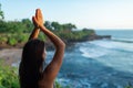 A young woman meditates by the sea Royalty Free Stock Photo