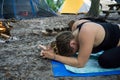 Young woman meditating with Kali mudra hands yoga pose while camping in the forest