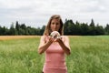 Young woman meditating in nature holding crystal ball Royalty Free Stock Photo