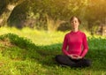 Young woman meditating outdoors Royalty Free Stock Photo