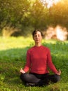 Young woman meditating outdoors Royalty Free Stock Photo