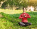 Young woman meditating outdoors Royalty Free Stock Photo