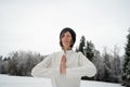 Young woman meditating outside