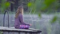 Young woman meditating on the shore of a lake Royalty Free Stock Photo