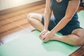 Young woman meditation while practicing yoga indoor Royalty Free Stock Photo