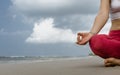 Young woman meditation in a yoga pose on the tropical beach Royalty Free Stock Photo